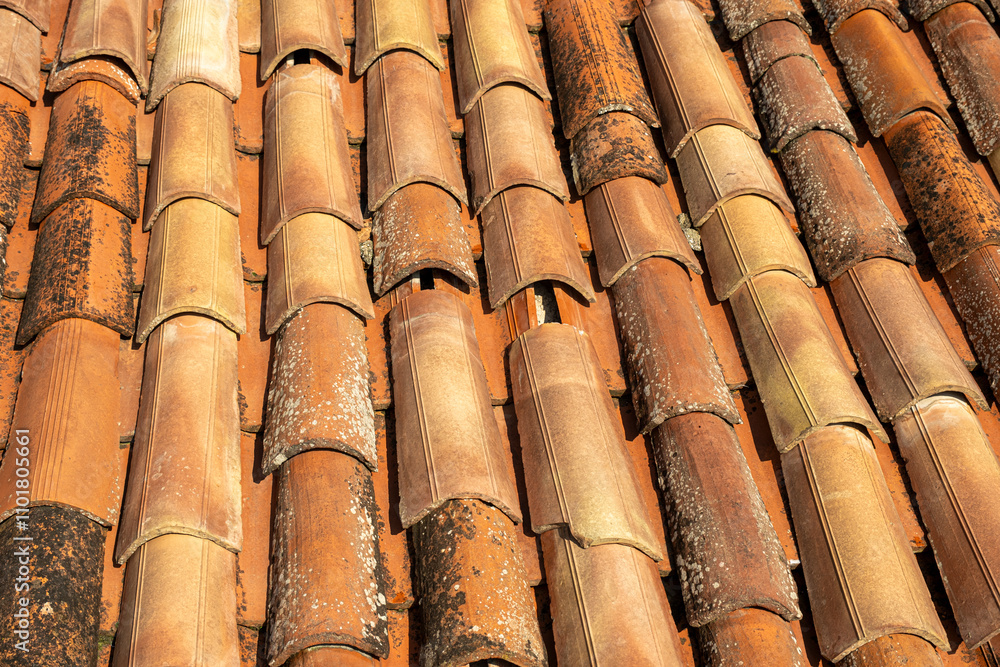 This is a closeup view showcasing a roof that has many tiles on it This is a closeup view showcasing a roof that has many tiles on it