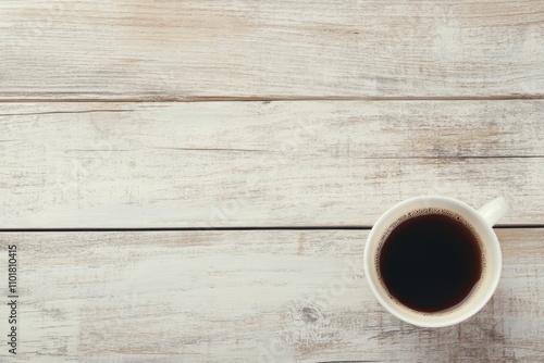 Coffee cup and plant arrangement on wooden table during morning hours