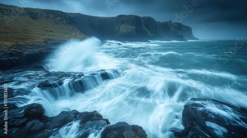 Dramatic Coastal Scene with Turbulent Waves Crashing Against Rocky Shoreline Under Moody Skies, Capturing Nature's Raw Power and Beauty