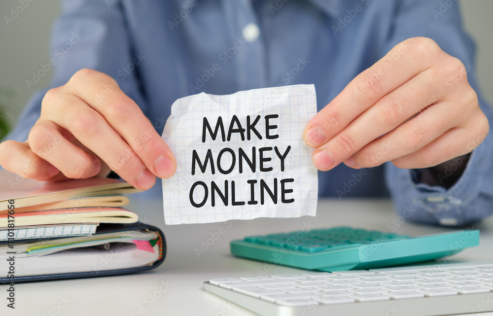 Fototapeta premium MAKE MONEY ONLINE, message on the card shown y a businesswoman