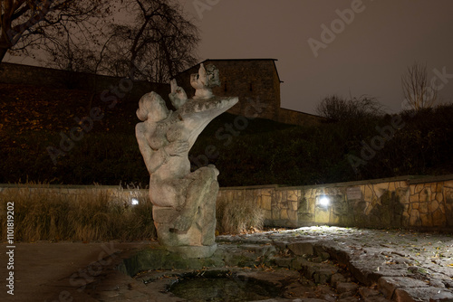 A night image of the 'Biruta Spring' located by the walls of the National Museum in Kielce and feeding the pond in the city's public park 