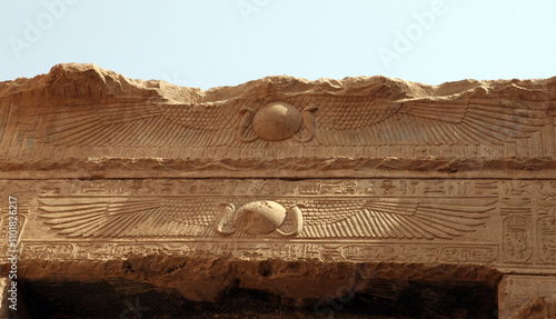 Carvings of spread Vulture wings on a stone lintel at the Temple of Horus, Edfu Egypt
