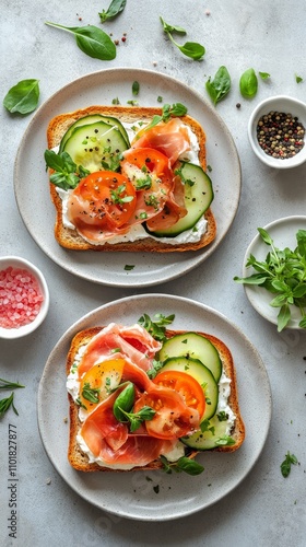 Delicious open faced sandwiches topped with fresh vegetables and cured meat o...