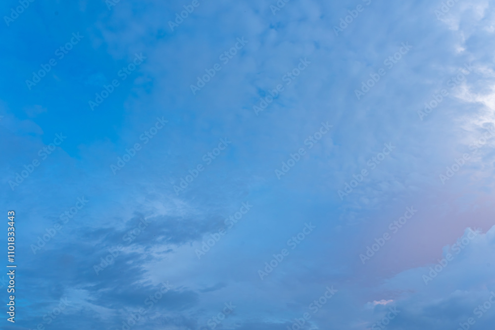 Fluffy white clouds drift across a vibrant blue sky, a breathtaking natural canvas Fluffy white clouds drift across a vibrant blue sky, a breathtaking natural canvas
