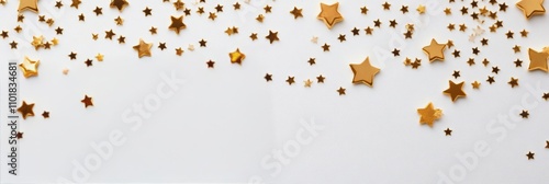 Decorative golden stars and glitter scattered on a white background for celeb...