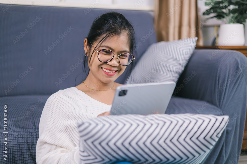 Women casual wear using tablet working call video conference with customer in workplace in living room at home, Happy asian girl relax sitting on desk do job in internet, having video chat, waving. Women casual wear using tablet working call video conference with customer in workplace in living room at home, Happy asian girl relax sitting on desk do job in internet, having video chat, waving.