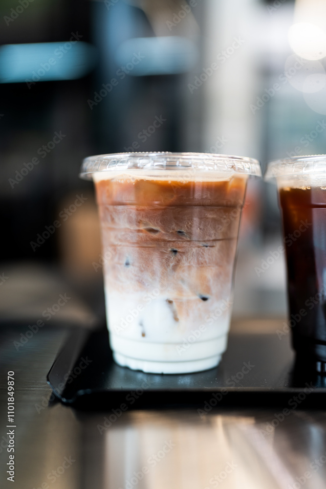 Latte coffee or iced coffee with milk in a take away glass Latte coffee or iced coffee with milk in a take away glass