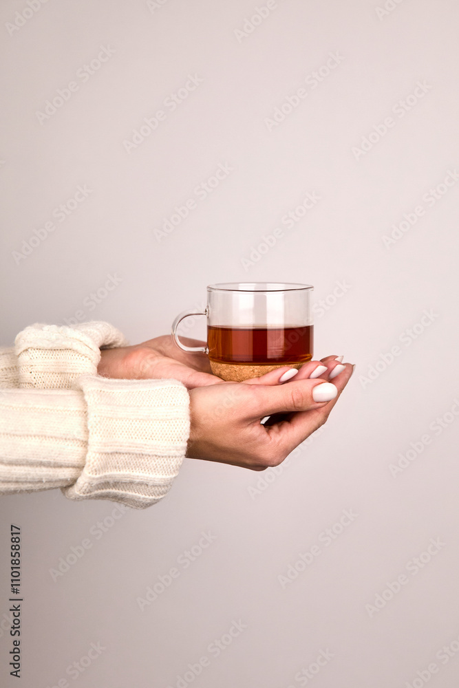 Brewed tea in a glass mug for morning wakefulness Brewed tea in a glass mug for morning wakefulness