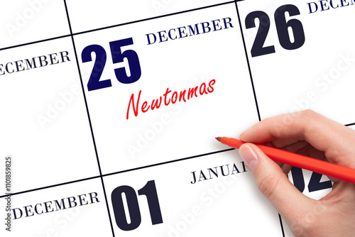 December 25. Hand writing text Newtonmas on calendar date. Save the date.