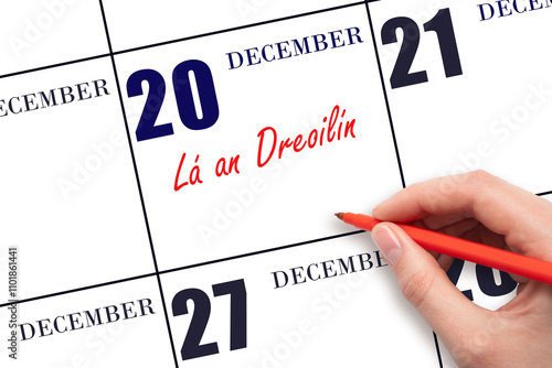 December 20. Hand writing text La an Dreoilin on calendar date. Save the date. photo