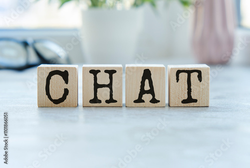 CHAT Word Written In Wooden Cube on wooden table