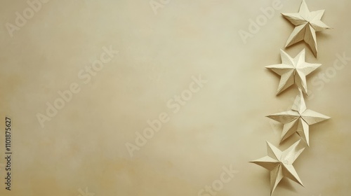 Decorative paper stars arranged on a neutral background for festive decoratio...