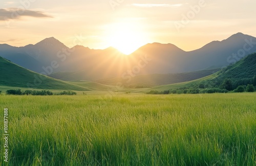 Majestic mountain landscape at sunset with green fields and rolling hills in ...