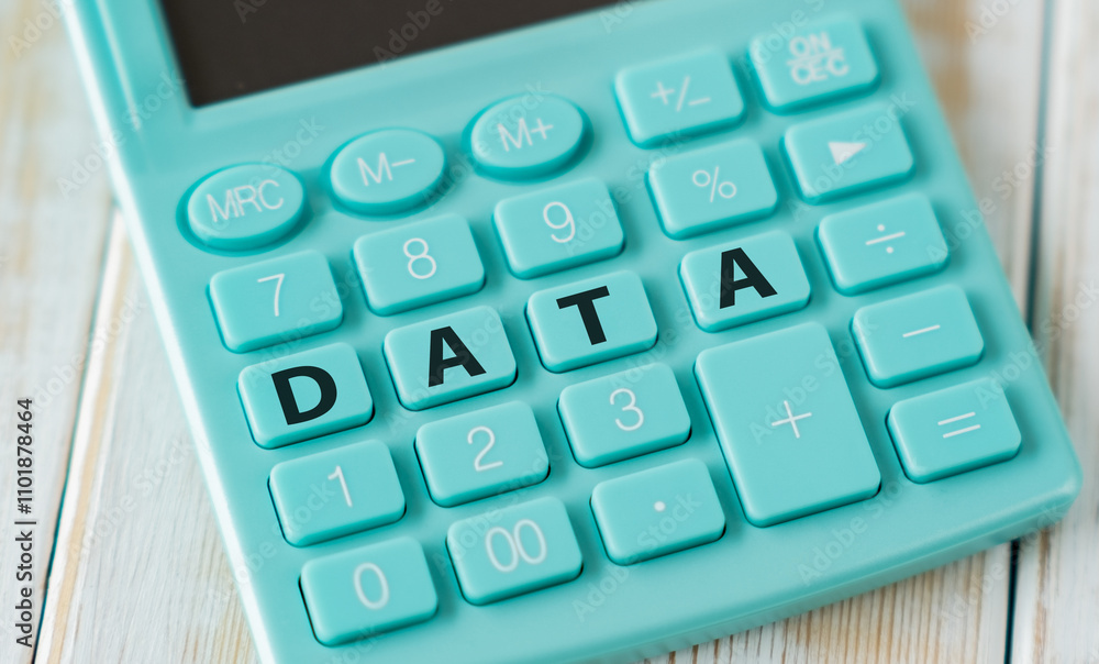 Data text on calculator keyboard on wooden table, business concept. Data text on calculator keyboard on wooden table, business concept.