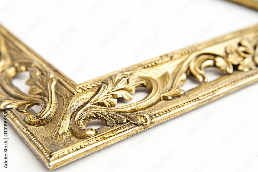 A gold picture frame sits on a white surface, ready for use A gold picture frame sits on a white surface, ready for use