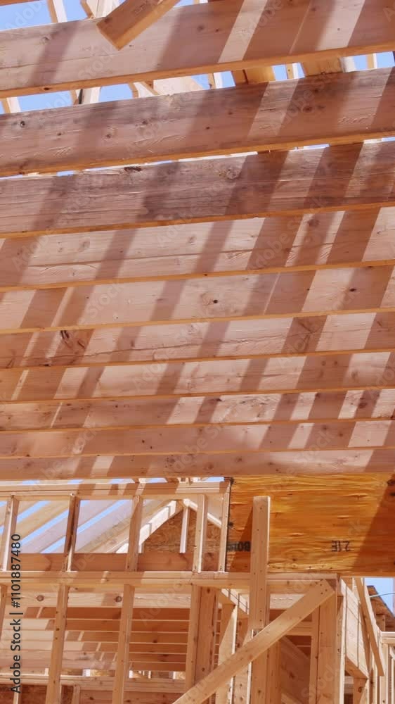 Building roof framing of building roof, featuring intersecting wooden beams support structures by woodwork Building roof framing of building roof, featuring intersecting wooden beams support structures by woodwork
