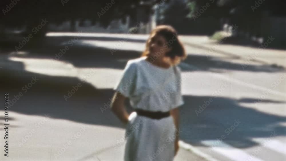 Woman tourist looking at architecture in historic city center. Interested traveler walking through deserted street in sunny morning, enjoying sightseeing. Vintage film. Retro 1980s. Travel archive Woman tourist looking at architecture in historic city center. Interested traveler walking through deserted street in sunny morning, enjoying sightseeing. Vintage film. Retro 1980s. Travel archive