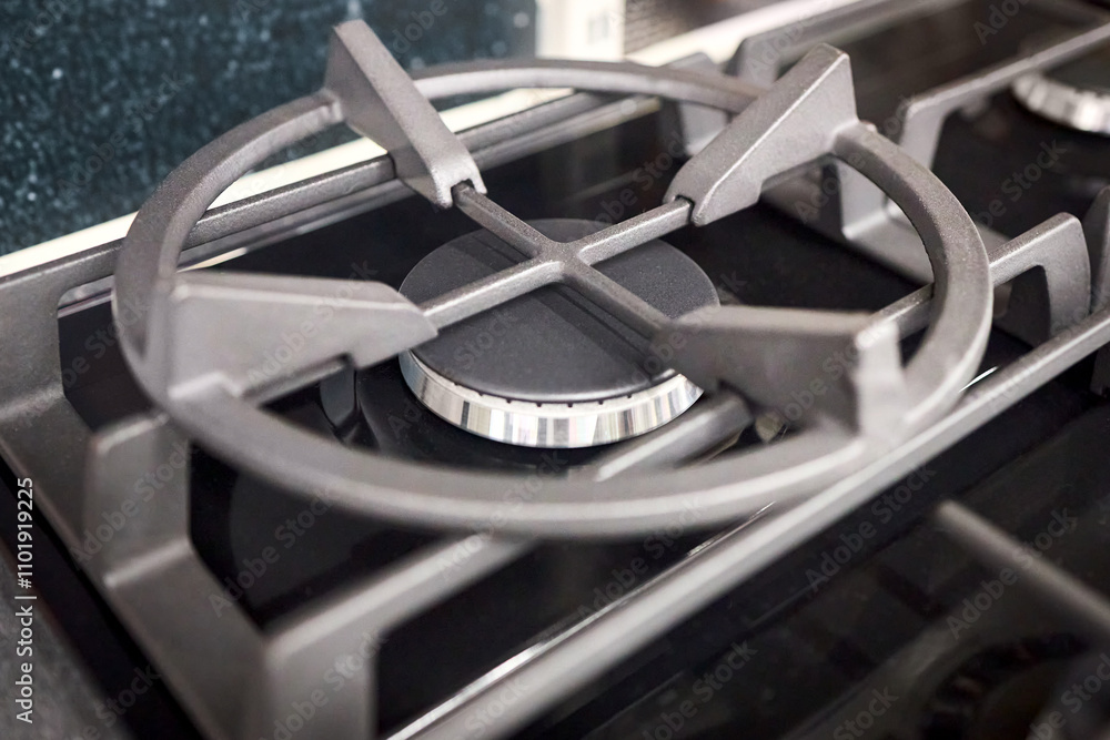 Gas stove burner burning without flame. Modern gas stove for cooking. Close up cast iron gas burner. Selective focus shot. Gas stove burner burning without flame. Modern gas stove for cooking. Close up cast iron gas burner. Selective focus shot.