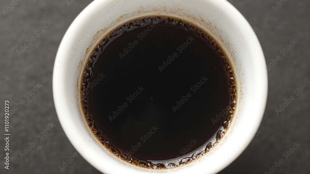 Rich espresso shot in minimalist white cup with crema layer Ideal for caffeine boost Rich espresso shot in minimalist white cup with crema layer Ideal for caffeine boost