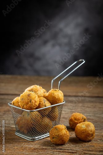 Codfish dumplings. fried dumpling, cod dumpling, fish meat, bacalao bunuelos.