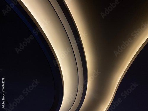 Modern office lighting. Thin lamps in office dark ceiling. LED white cold light over workplaces. Neon light arrow direction in perspective