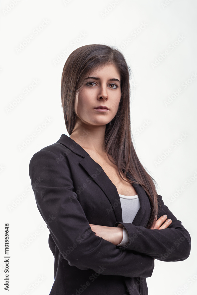 Serious young businesswoman crossing arms on white background Serious young businesswoman crossing arms on white background