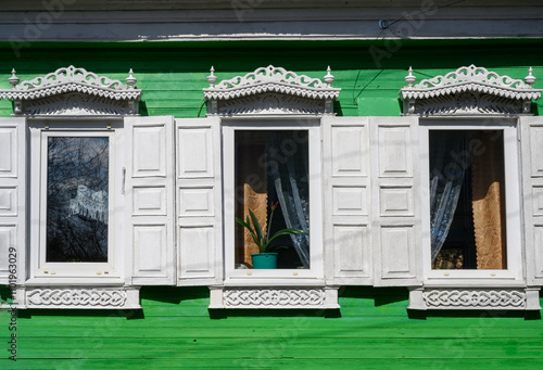 Fragment of an earier 20th century wooden house with carved platbands in Gorodets, Russia photo