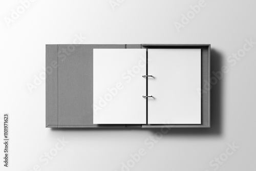 An open binder reveals a neatly secured A4 letterhead mockup, showcasing a polished design with a professional layout and metallic ring clips.