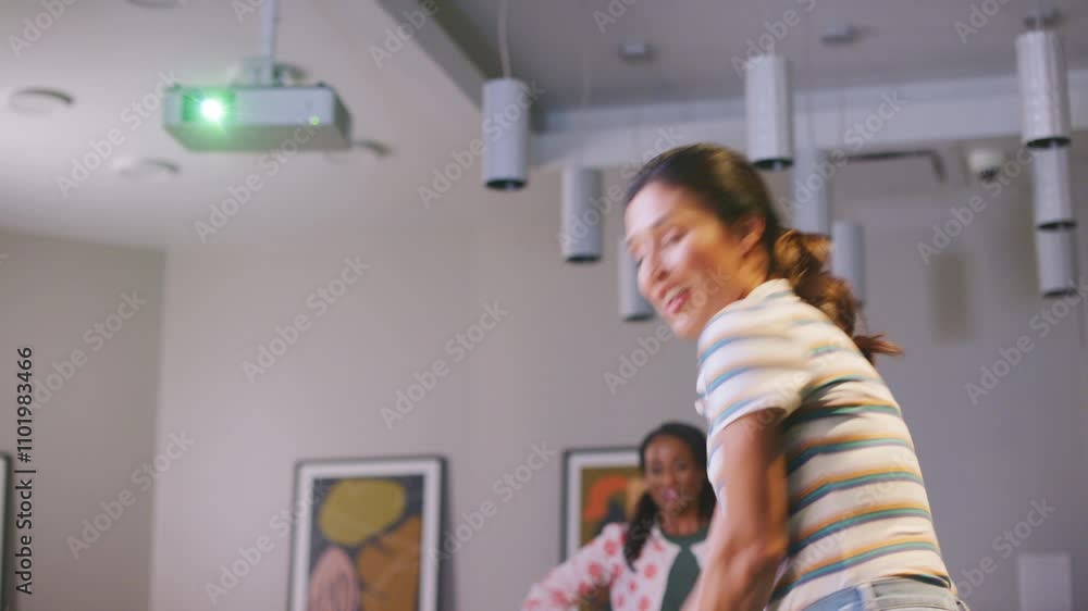 Woman swings a golf club in a virtual golf simulator room Woman swings a golf club in a virtual golf simulator room
