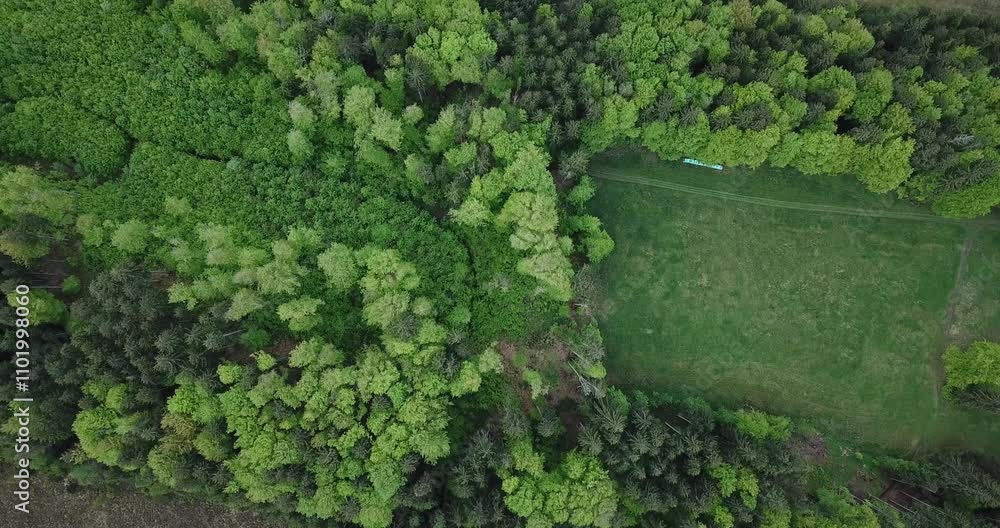 Aerial view, drone flight over a forest and Alps in the background at Staffelsee in Bayern, Germany Aerial view, drone flight over a forest and Alps in the background at Staffelsee in Bayern, Germany