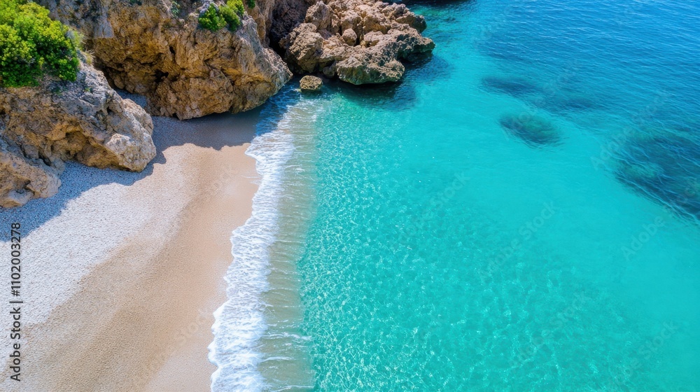 Lapping waves meet a sandy shoreline under the warmth of a sunny sky, with rocky outcrops and verdant vegetation framing the scenic beach scene. Lapping waves meet a sandy shoreline under the warmth of a sunny sky, with rocky outcrops and verdant vegetation framing the scenic beach scene.