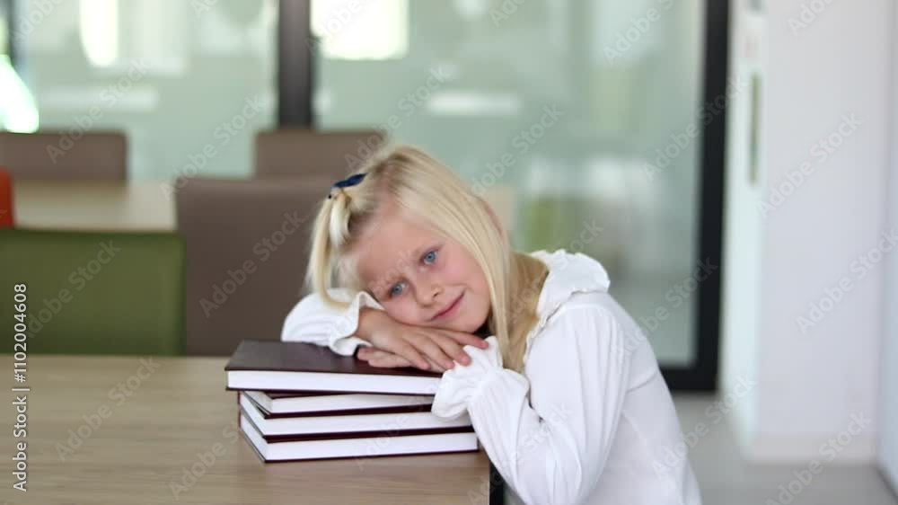 a squad of little schoolgirls lying on books a squad of little schoolgirls lying on books