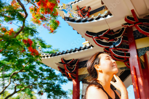 In early June, an Chinese woman is enjoying summer at at JiaGeng Park in Jimei, Xiamen, Fujian, China photo