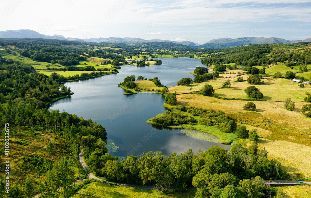 Esthwaite Lake, Lake District National Park, Cumbria. View NW to L-R Wetherlam, Bowfell, Langdale Pikes, Dunmail Raise, Helvellyn, Fairfield. Summer