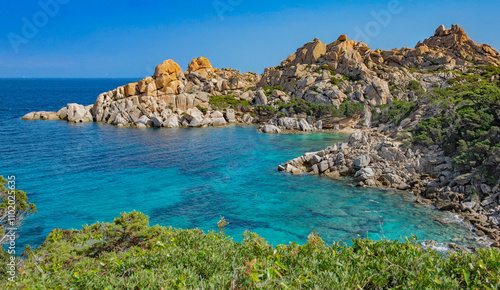 beautiful view on the crystalline anturquoise sea borded by cliffs and green plant at Santa Teresa Gallura in Sardinia Italy