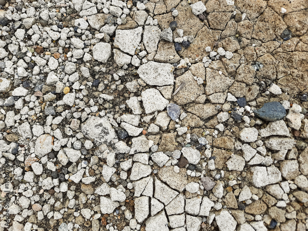Cracked Cement Surface with Exposed Gravel Details Cracked Cement Surface with Exposed Gravel Details