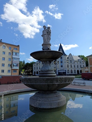 a fountain consisting of several levels and a sculpture depicting three women Chernyakhovsk 2024 July 14 photo