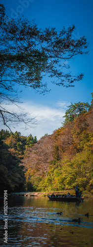 Geibikei gorge valley Japan, travel destinations in autumn or fall season, color of leaf in yellow, orange and green. Nature and mountain attraction view. floating activity. Japan sightseeing. photo