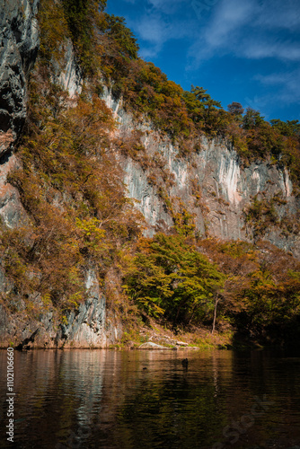 Geibikei gorge valley Japan, travel destinations in autumn or fall season, color of leaf in yellow, orange and green. Nature and mountain attraction view. floating activity. Japan sightseeing. photo