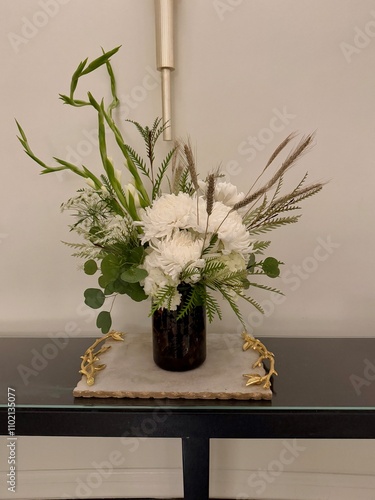 A flower arrangement on a table in the entrance at the Waldorf Astoria Hotel in Atlanta, GA photo