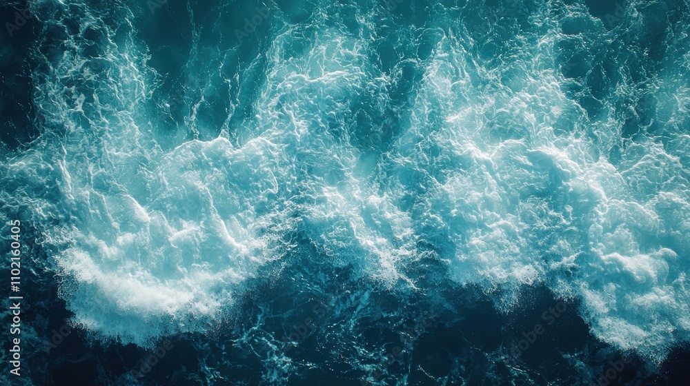 Waves crashing against the shore at sunrise with vibrant blue and white colors in the ocean Waves crashing against the shore at sunrise with vibrant blue and white colors in the ocean