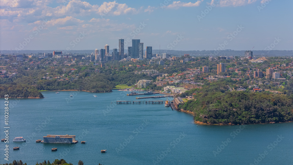 Naklejka premium Aerial View of Sydney Harbour Balmain Darling harbour Sydney CBD cockle Bay Wharf North Sydney harbour bridge Lavender Bay Milsons Point Manly on a warm summer day blue skies