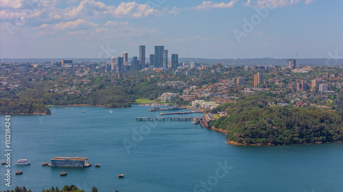 Aerial View of Sydney Harbour Balmain Darling harbour Sydney CBD cockle Bay Wharf North Sydney harbour bridge Lavender Bay Milsons Point Manly on a warm summer day blue skies  photo