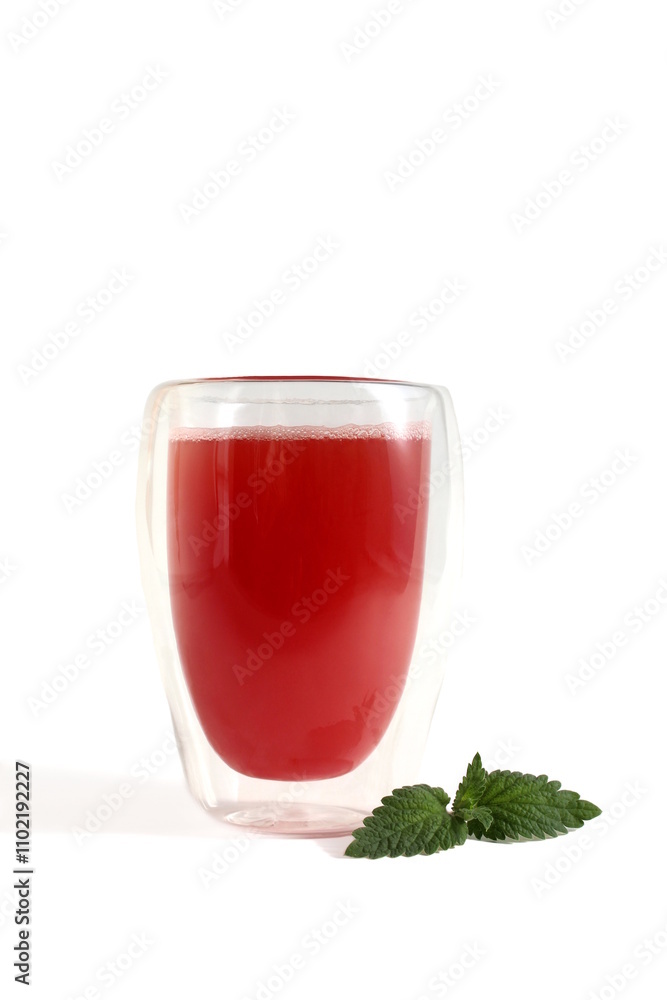 There is a glass with watermelon juice on a white background. There is a glass with watermelon juice on a white background.