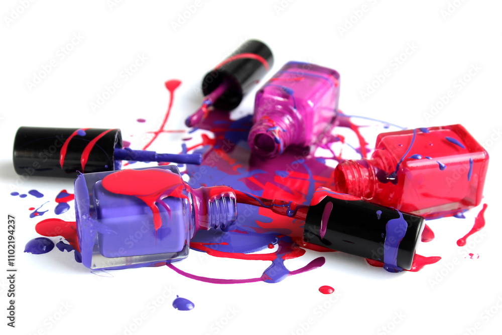 Open spill varnish of three colors in glass bottles is located on a white background.
Open spill varnish of three colors in glass bottles is located on a white background.