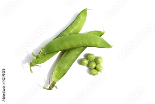 Green fresh peas lie on a white background.	