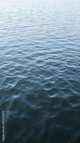 Rippling waves on a serene lake reflecting the sky, fluidity, relaxing