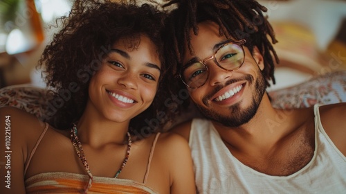 A happy young couple smiling at the camera.