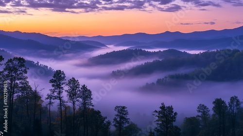 Dawn breaks over a serene mountain valley shrouded in soft mist and vibrant colors photo