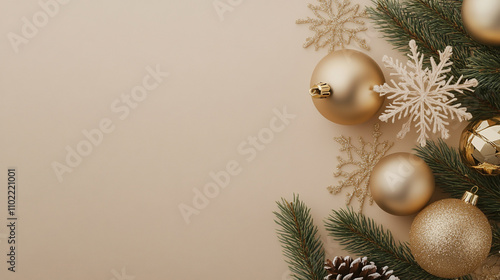 Elegant holiday decorations with gold ornaments and snowflakes on a soft background